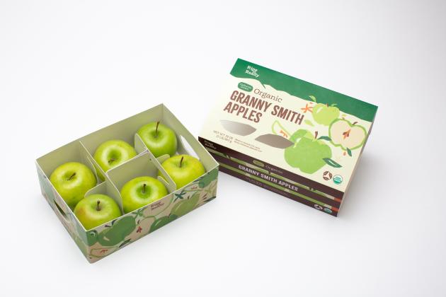 Paperboard packaging with a sliding cover with six granny smith apples inside it.